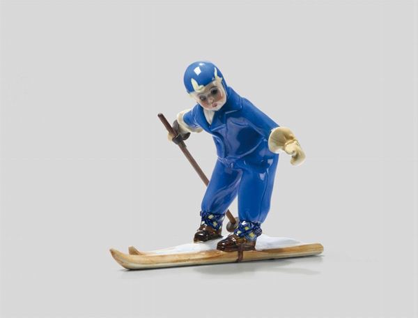 Lenci, Torino, 1930 ca. A figure of a young skier in earthenware ceramics with a polychrome decor, holding  [..]