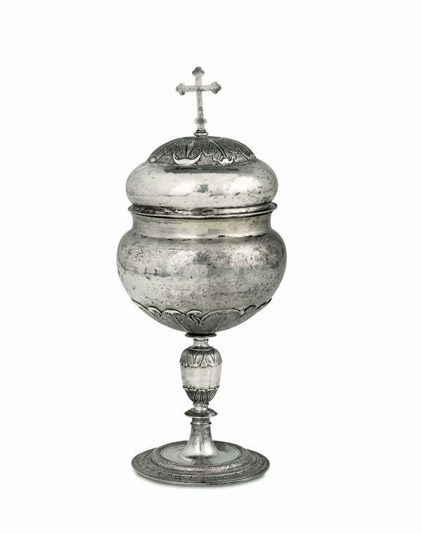 A ciborium in molten, embossed, chiselled and engraved silver, Siena, first half of the 17th century, stamp for silversmith Andrea Argentini (A within a circle) and city's guarantee mark (Sienese balzana).