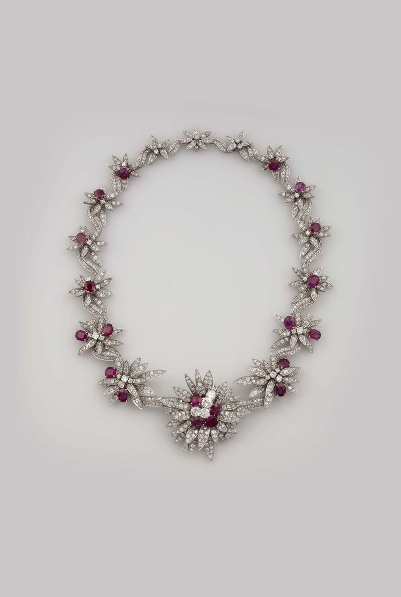 Settepassi, Florence. A platinum, diamond and ruby necklace.The central piece can be worn as a brooch and the two lateral flowers as earrings.1940s. Boxed.  - Auction Fine Jewels - Cambi Casa d'Aste