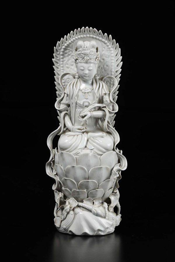 A Blanc de Chine figure of Guanyin with ruyi on lotus flower, China, Qing Dynasty, late 19th century