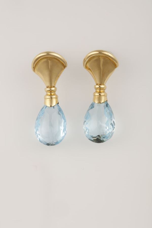Pair of blue topaz and gold earrings