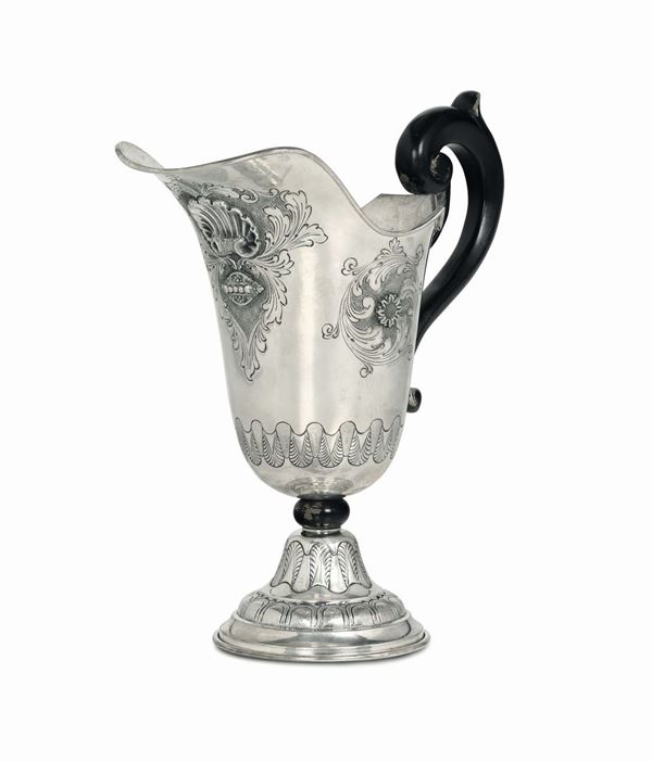 A spout in molten, embossed and chiselled silver. Italy 20th century