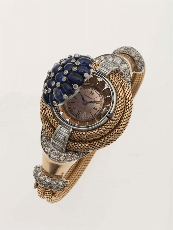 Bracelet watch in platinum and 750 yellow gold with cabochon sapphires and diamonds. 
