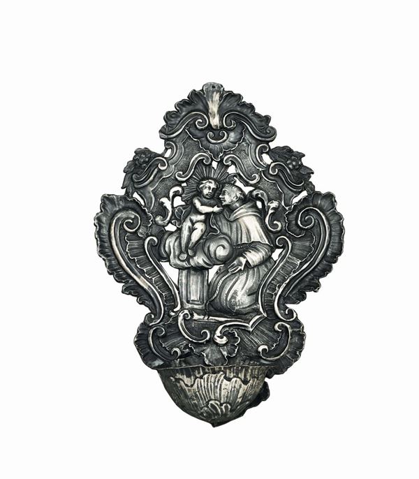 A holy water font in embossed and chiselled silver, Genoa, second half of the 18th century, Torretta stamp with faded date.