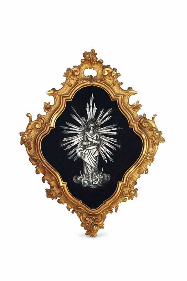 An image of the Immaculate Conception in embossed and chiselled silver. For the Frame, gilded wood and velvet. Manufacture from Liguria (?), end of the 18th - beginning of the 19th century, guarantee marks for large and small works during the French occupation (1803 - 1809), one of them depicting the letters E and T with a head of Mercury, the other depicting the letter E.