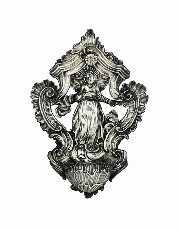 A holy water font in embossed and chiselled silver, Genoa, half of the 18th century, Torretta stamp with faded date.