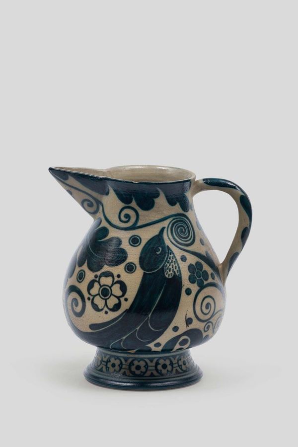 Galileo Chini, Florence, 1910 ca. A gres pitcher with a blue glaze decor of birds and leaves