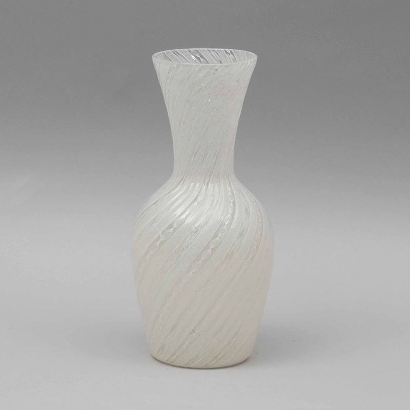 Venini, Murano, 1950 ca. A blown glass vase with a tall flared bellmouth opening and a twisted cane decor  - Auction Murano '900 - II - Cambi Casa d'Aste