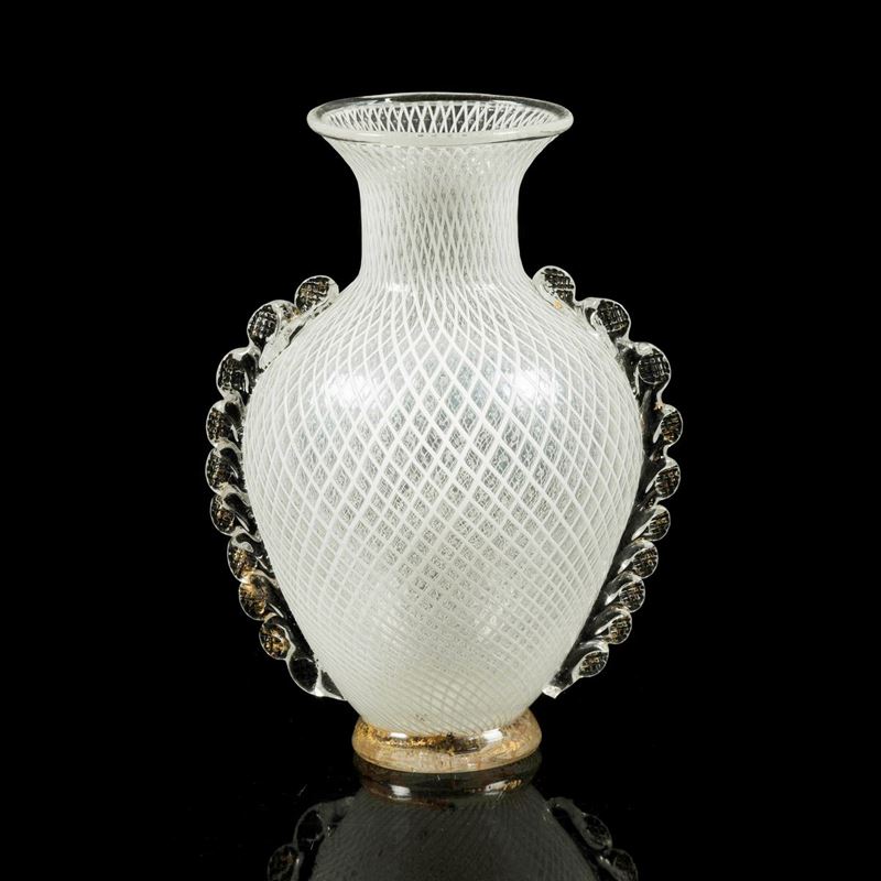 Vetreria Aureliano Toso, Murano, 1940 ca. A blown glass vase with a reticulated decor, crested handles and a crystal base with gold leaf  - Auction Murano '900 - II - Cambi Casa d'Aste