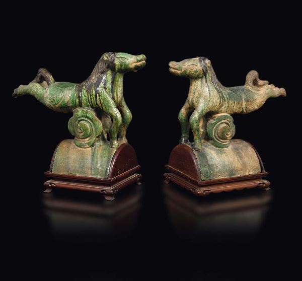 A pair of Sancai glazed pottery shingles with horses, China, Ming Dynasty, 17th century