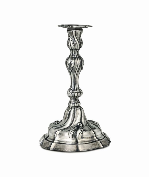 A candle holder in embossed and chiselled silver, Turin, second half of the 18th century. Stamp for silversmith Giuseppe Paroletto (1765 - 1800) stamps for assayer Bartolomeo Bernardi (1778 - 1816) and tolerance stamp for old pieces marketed from 1824 on.