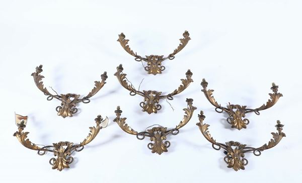 Sette appliques a due luci in metallo e legno intagliato e argentato a mecca, prima metà del XIX secolo