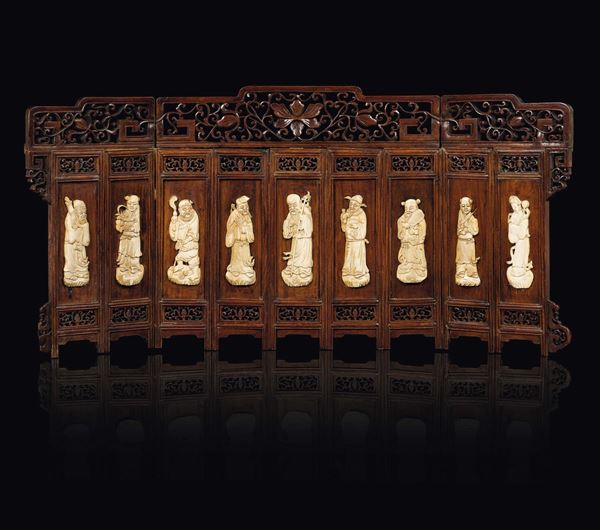 A small wooden screen with carved ivory figures of wise men, China, Qing Dynasty, 19h century