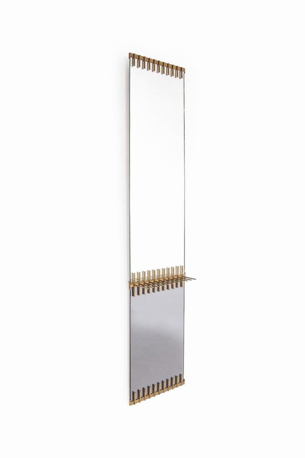 Ettore Sottsass, an important and rare mirror with a brass frame, one element in fumed crystal and the other white. Santambrogio and De Berti production, Italy, 1958 cm 30x181x12.5 Bibliography (similar model) E. Paoli, Quaderni Vitrum n. 8, specchi e specchiere, pag. 124.