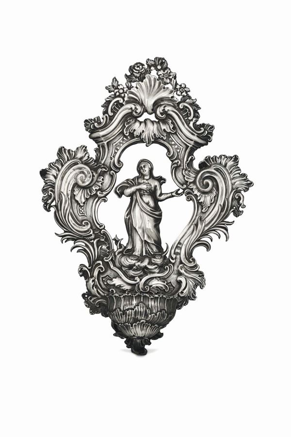 A holy water font in embossed and chiselled silver, Genoa, Torretta stamp for the year 1773, guarantee marks from the 19th century (coiled dolphin and Saint Maurice cross) and unidentified AV mark.