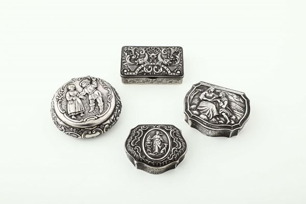 A group of four tobacco boxes in molten, embossed and chiselled silver, two from England 19th-20th century