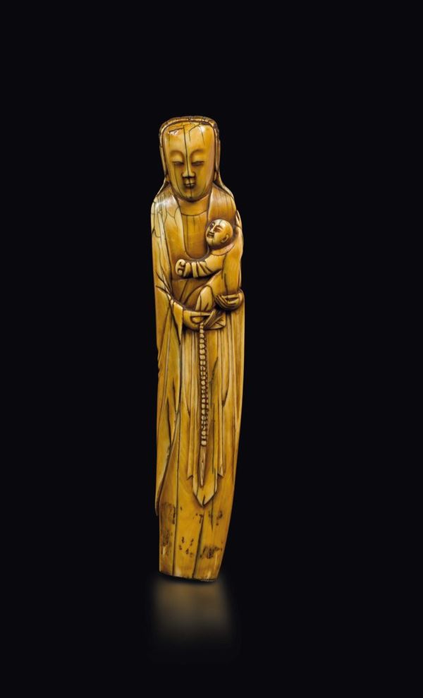 A carved ivory figure of woman with child, China, Ming Dynasty, 17th century
