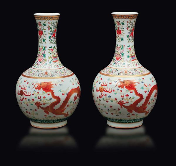 A pair of polychrome enamelled porcelain bottle vases with dragon and phoenix, China, Qing Dynasty, Guangxu Mark and of the Period (1875-1908)