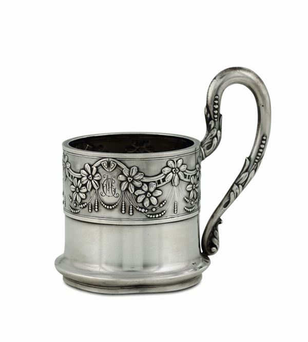 A cup holder in molten, embossed and chiselled silver, Moscow first quarter of the 20th century.