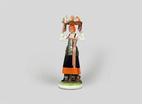 Abele Jacopi, Lenci, Turin, 1950 ca. A figure of a woman in a regional costume from Piedmont, earthenware ceramics with a polychrome decor