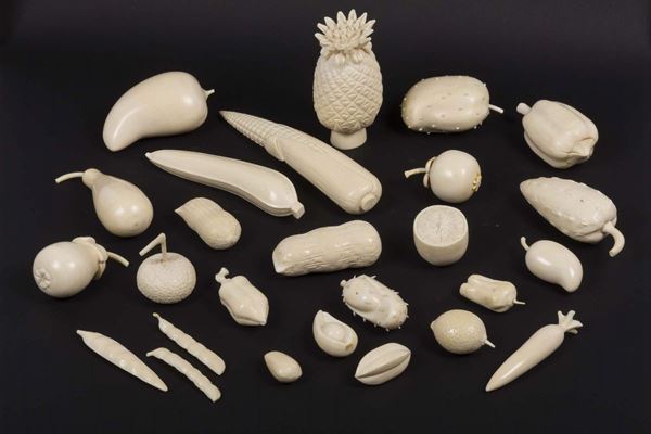 Twenty-six carved ivory fruits, China, early 1900s