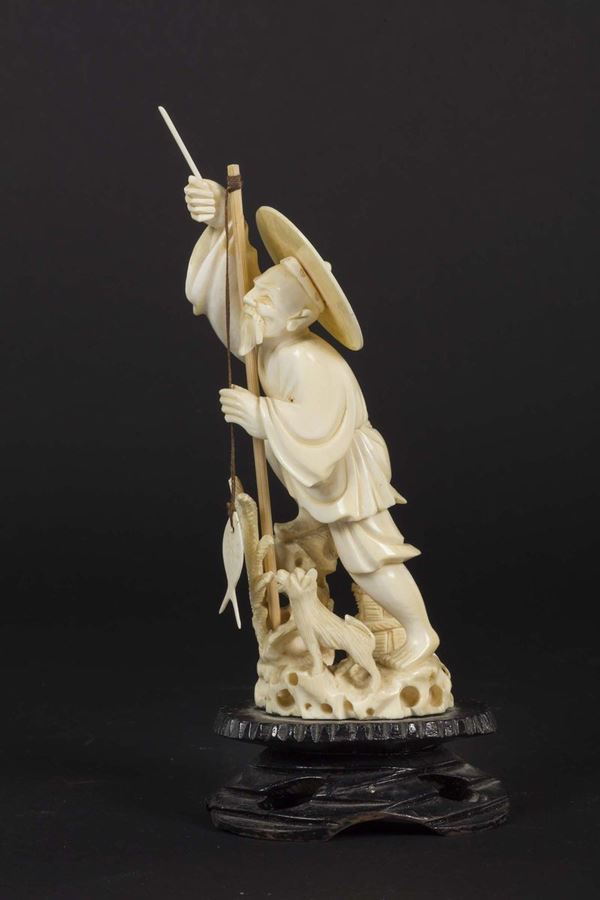 A carved ivory figure of fisherman, China, early 20th century