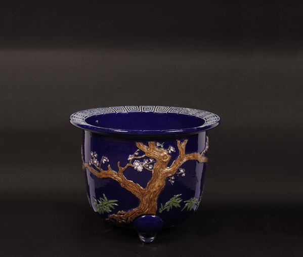 A blue-ground cachepot with naturalistic decoration in relief, China, Qing Dynasty, 19th century
