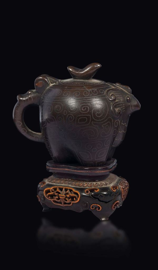 A small Shisou bronze teapot with silver inlays depicting taotie mask, China, Qing Dynasty, 18th century