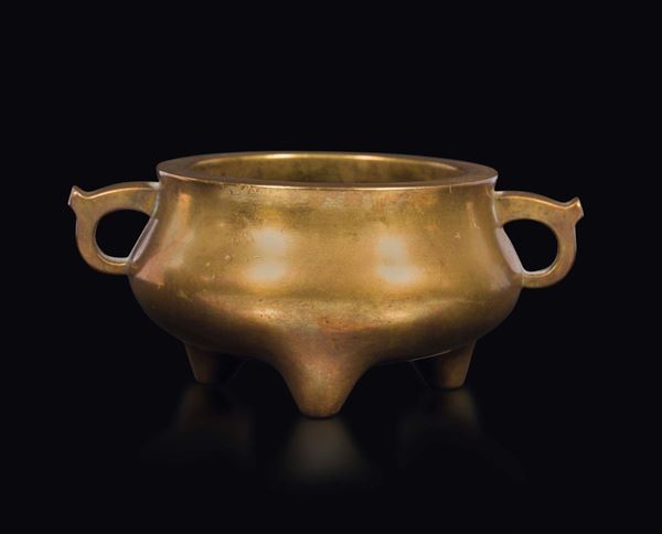 A gilt bronze tripod censer with handles, China, Qing Dynasty, 18th century