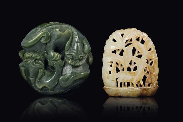 A spinach green two dogs jade and a white and russet jade with deer between trees, China, Ming Dynasty, 17th century