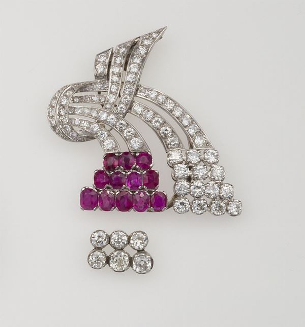 Platinum clip with Burmese rubies and old cut diamonds. The ruby insert can be alternated with a diamond one