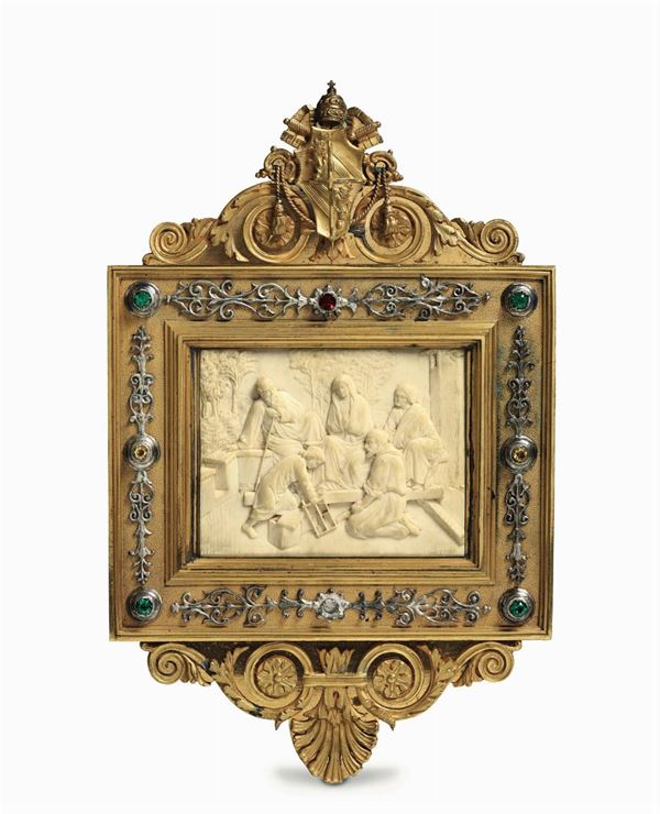 An important compendium with a plaque in high-relief carved ivory depicting a carpenter baby Jesus,  [..]