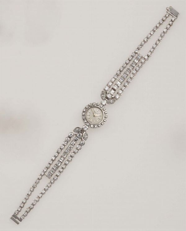 Piaget. Lady's platinum and diamond-set bracelet watch