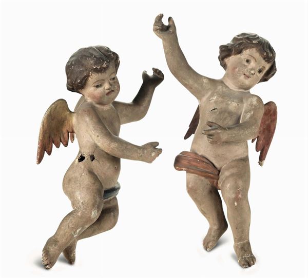 Due angioletti in legno dipinto, XIX secolo