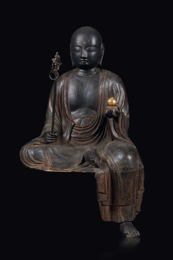 A wooden figure of seated Kasyapa with khakkhara, China, Ming Dynasty, 17h century