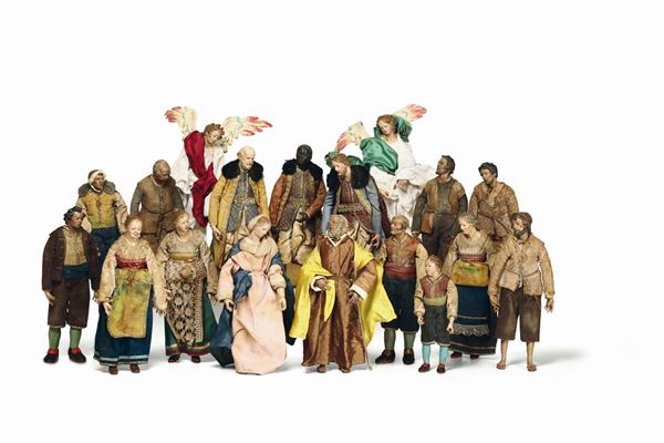 A nativity scene made up of 18 figures of commoners, Madonna and Saint Joseph, Wisemen and Angels, likely from the 19th century