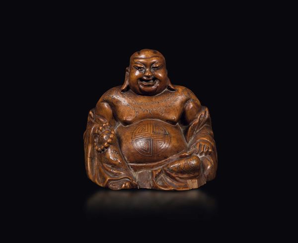 A wooden figure of Budai with silver inlays, Cina, Qing Dynasty, 19th century