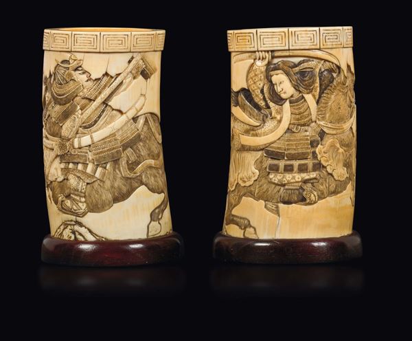 A pair of carved ivory brushpots with figure of samurai and inscriptions, Japan, Meiji Period, 19th century