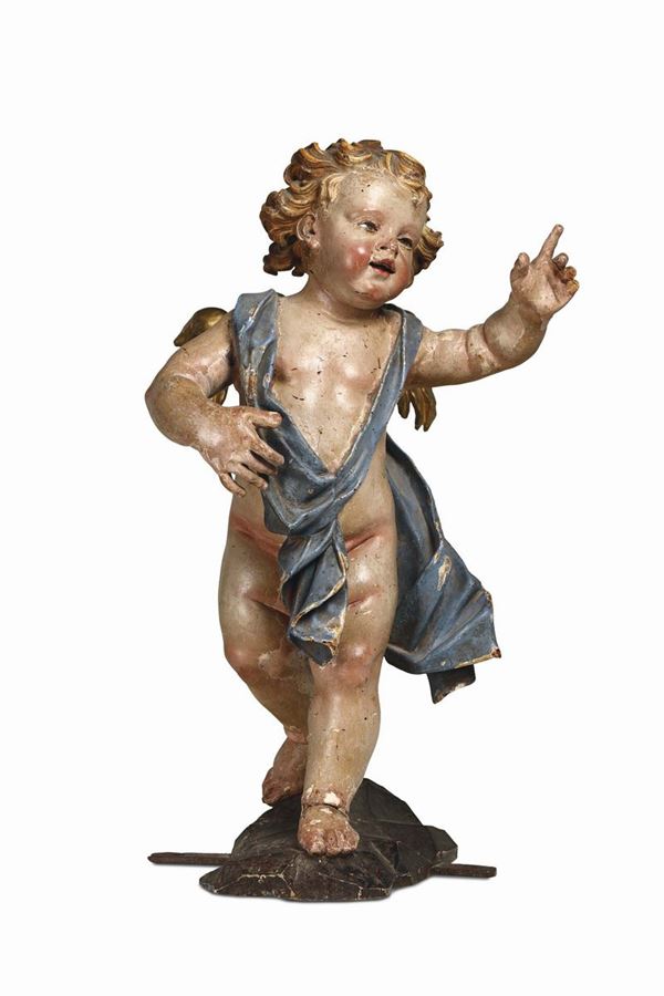 A large putto in carved, gilded and painted wood. Anton Maria Maragliano (attributed to). Genoa 17th-18th century