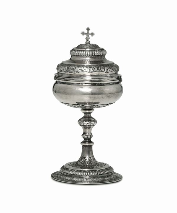 A ciborium in molten, embossed and chiselled silver, Turin, half of the 18th century, mark for stamper Giovanni Damone ? (1733 - 1753) and unidentified siversmith's stamp.