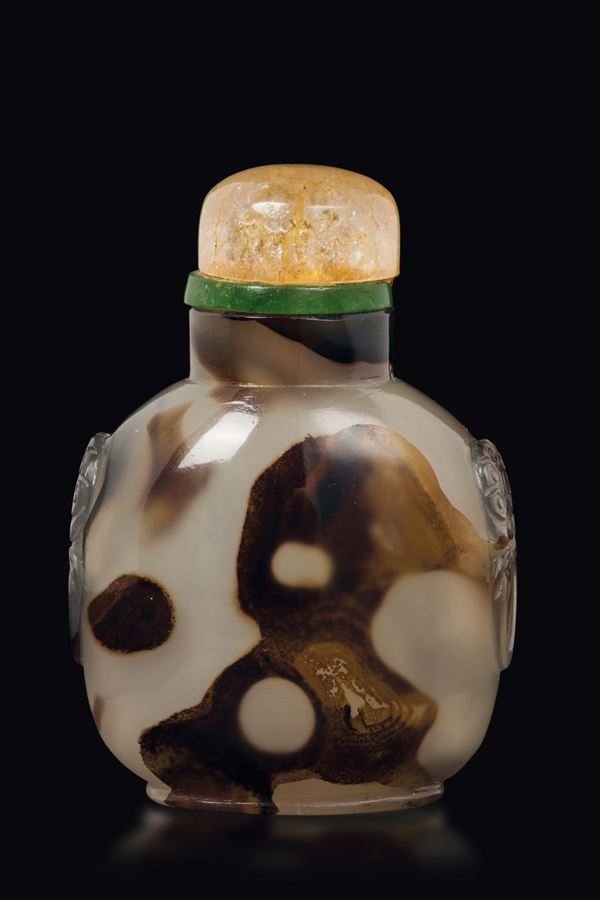A moss agate snuff bottle with mask handles, China, Qing Dynasty, 19th century