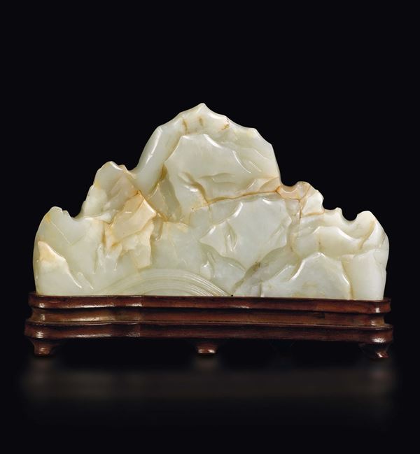A white and russet jade brush holder in the shape of a mountain, China, Qing Dynasty, Qianlong Period (1736-1795)