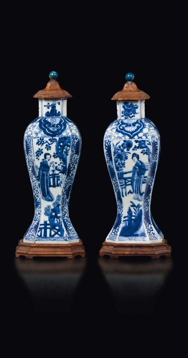 A pair of blue and white vases and wooden cover with Guanyin, China, Qing Dynasty, Kangxi Period (1662-1722)