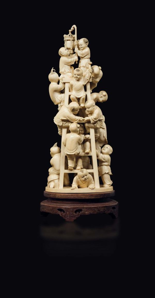A carved ivory playing children group, China, early 20th century