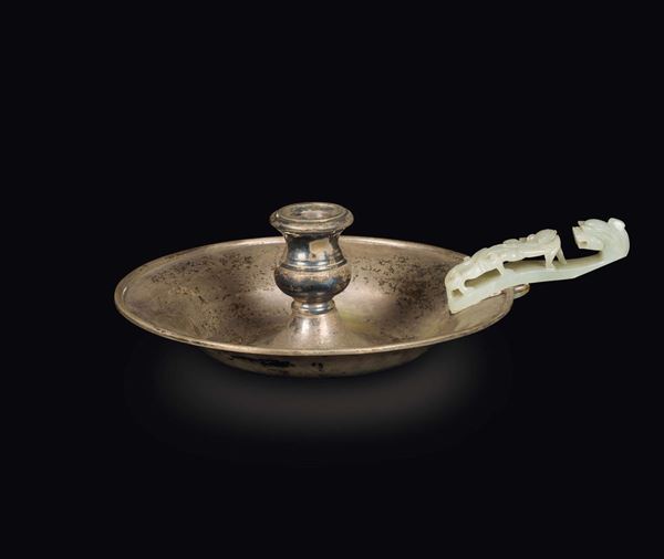 A silver candlestick with white jade dragon belthook handle, China, Qing Dynasty, 19th century