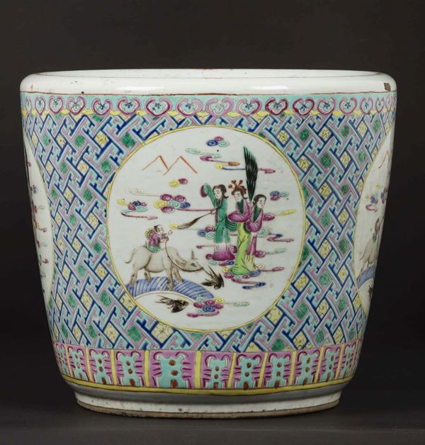 A polychrome enamelled porcelain cachepot with Guanyin within reserves, China, Qing Dynasty, 19th century
