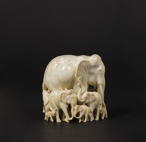 A carved ivory elephants group
