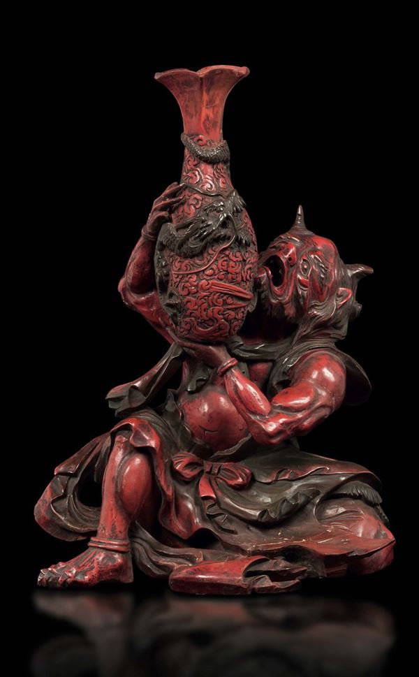 A red lacquer figure of demon with vase, Japan, 19th century