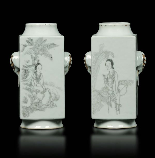 A pair of grisaille porcelain Cong vases with elephant's head-handles depicting Guanyin, landscape and inscriptions, China, early 20th century