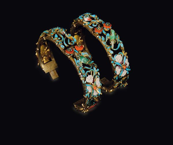 Two gilt silver bracelets with coral, turquoise and jadeite details, China, Qing Dynasty, late 19th century